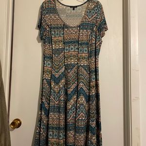 Multi colored teals,greens , blues and orange colors in the dress